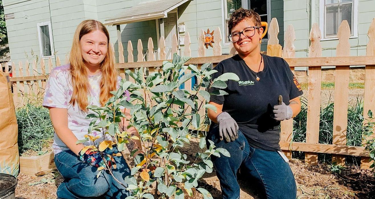 Arbor staff volunteering in a garden.